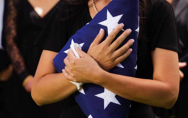 Holding flag to heart